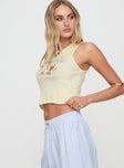 side view of model wearing Princess Polly Music In The Park Tank Top Cream Sleeveless Crew Neck 