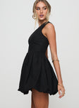 side view of model wearing Princess Polly Debut Bubble Hem Mini Dress Black Asymmetric Neckline 