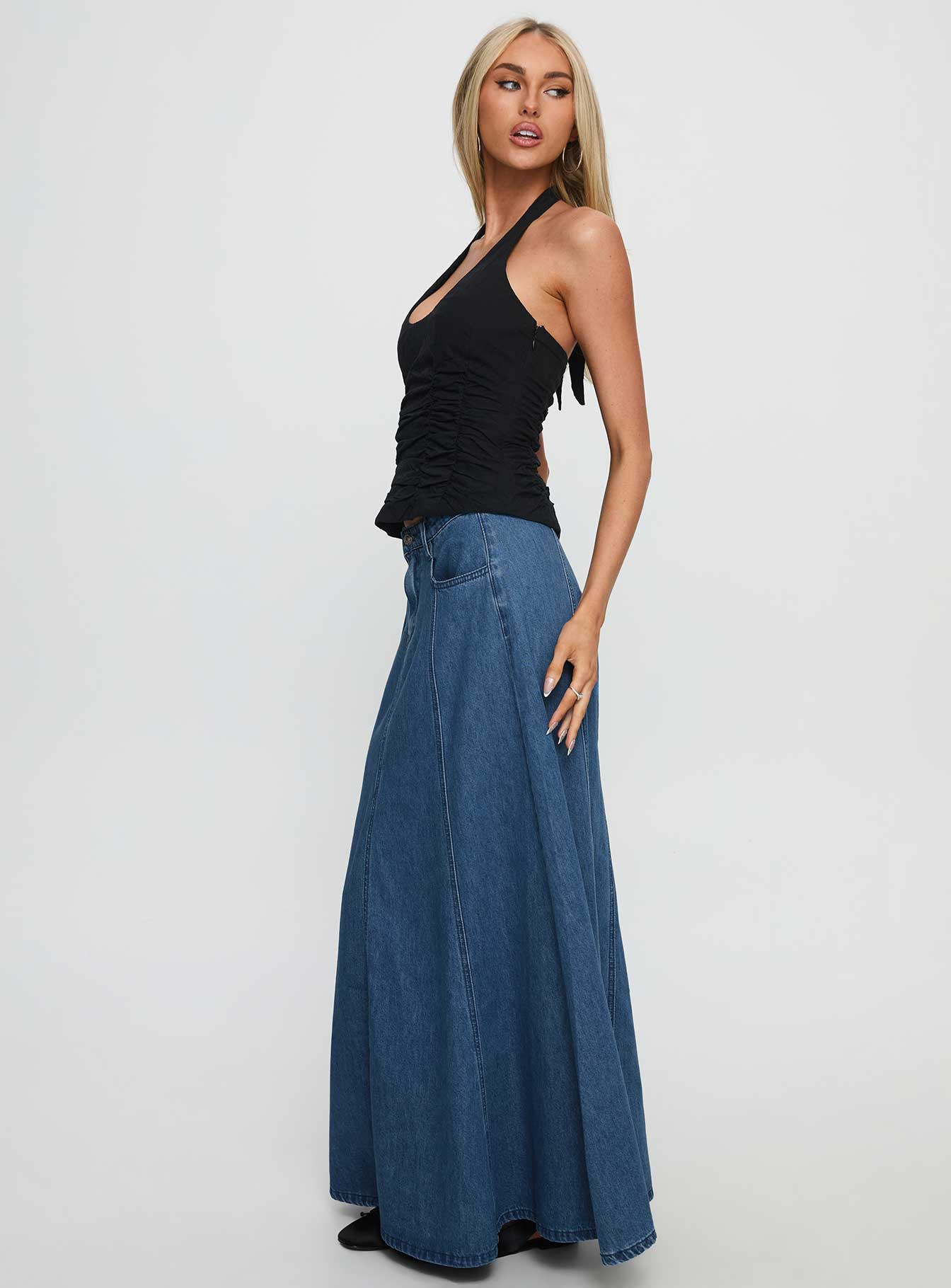   side view of model wearing Princess Polly Charleigh Soft Pleat Denim Maxi Skirt Mid Blue Wash Maxi 