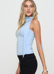 side view of model wearing Princess Polly Mathias Top Blue Sleeveless High Neck 