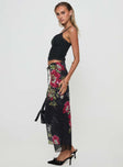   side view of model wearing Princess Polly Paganio Maxi Skirt Black Floral Maxi 