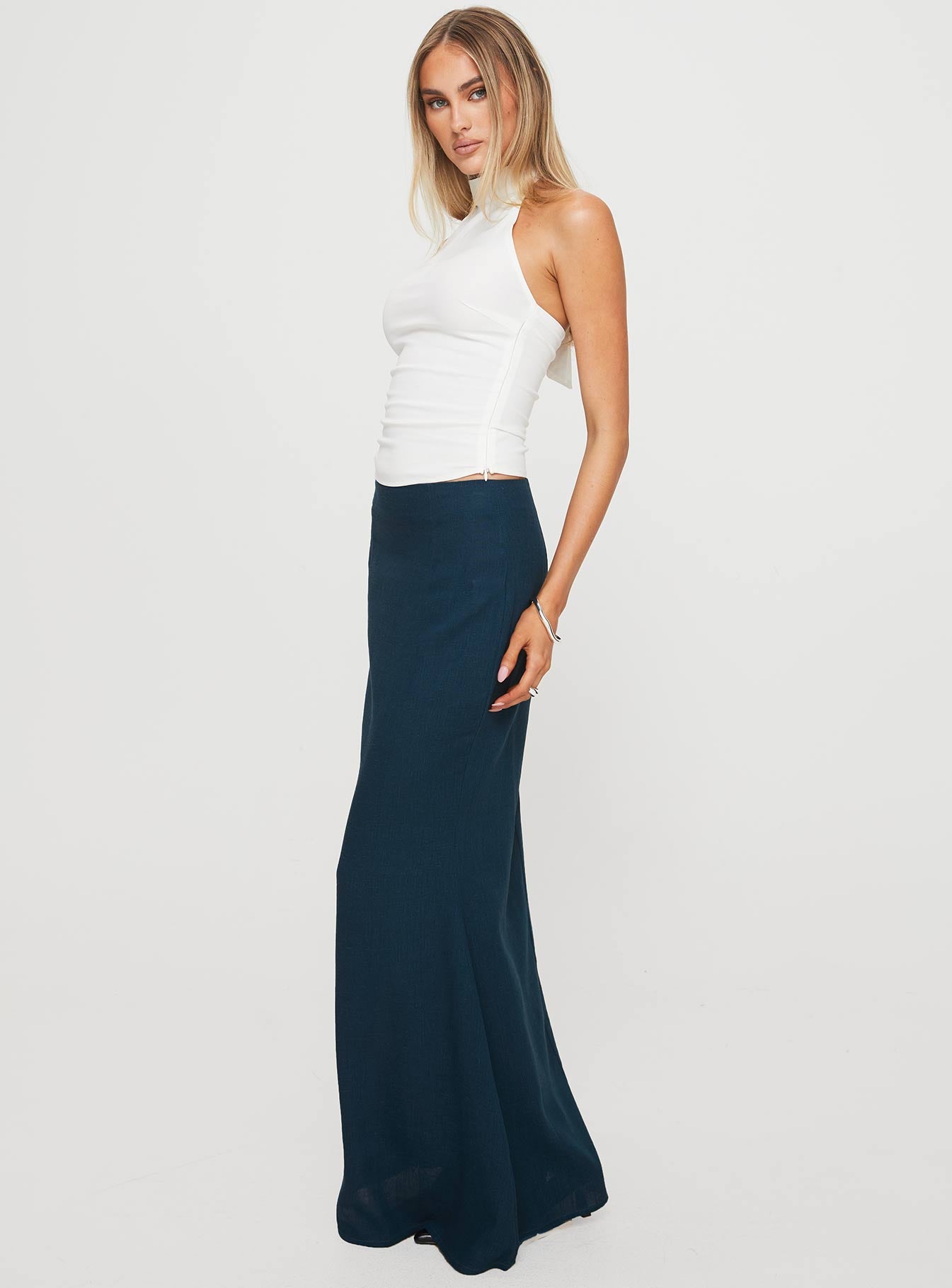   side view of model wearing Princess Polly Sophia Maxi Skirt Navy Maxi 