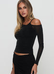 side view of model wearing Princess Polly Amarante Top Black Full Sleeves Asymmetric Neckline 