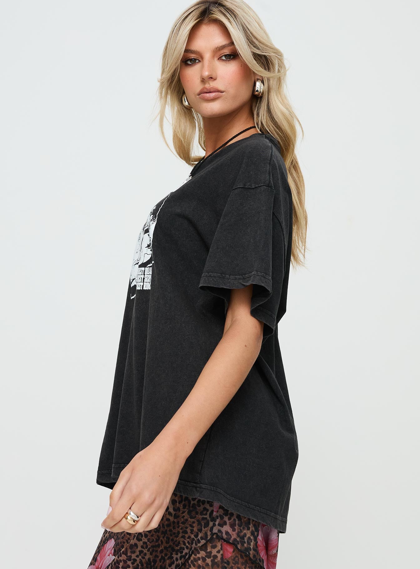 side view of model wearing Princess Polly Electric Vintage Oversized Tee Black Half Sleeves Half Sleeves Crew Neck Crew Neck 
