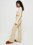 Knit set  Long sleeve crop style top, scoop neckline, flared sleeves, low back with cross fastening ties Mid-rise slightly flared pants, elasticated waistband  Good stretch, unlined
