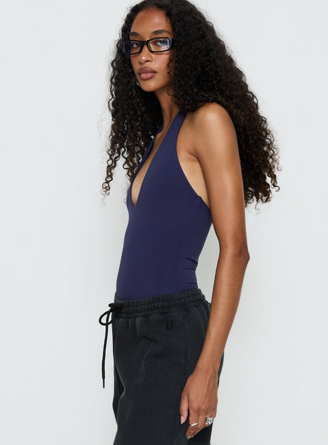 side view of model wearing Princess Polly Someone New Halter Bodysuit Navy Sleeveless 
