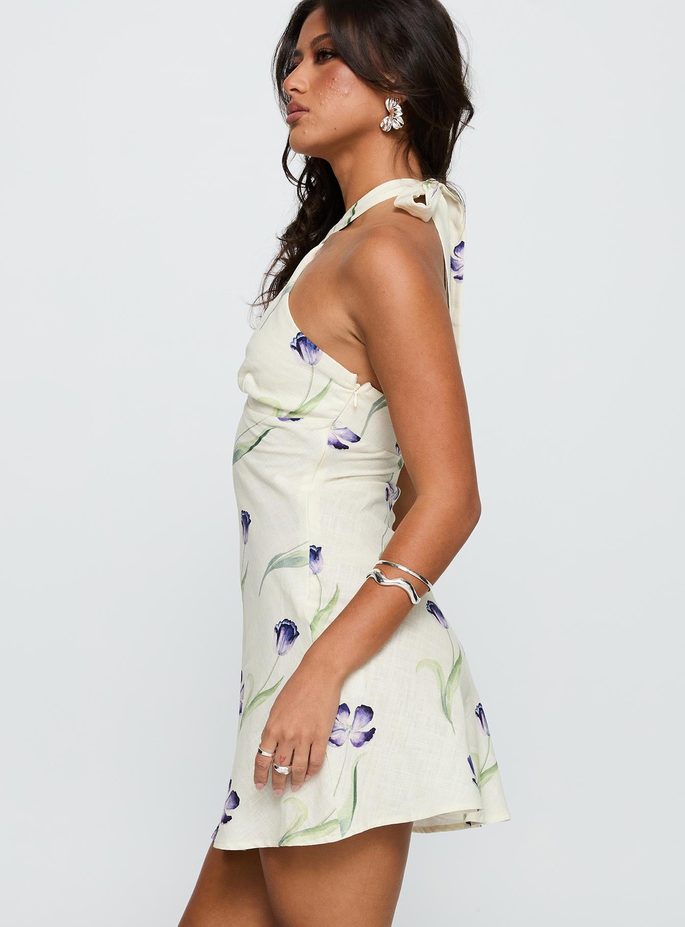 side view of model wearing Princess Polly Havenna Halter Linen Blend Mini Dress Cream Floral Plunger 