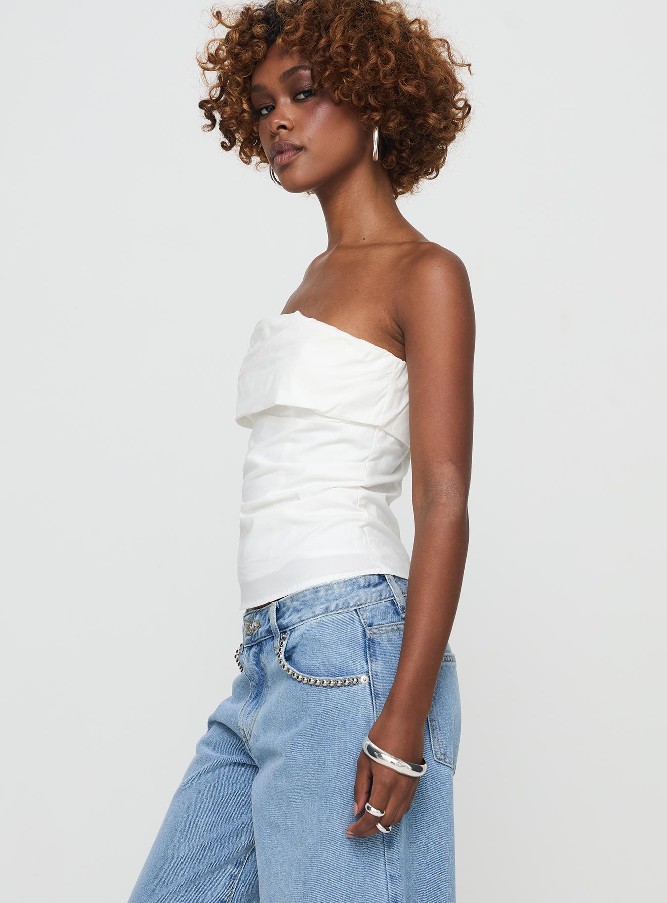 side view of model wearing Princess Polly Xandria Strapless Top White Sleeveless straight 