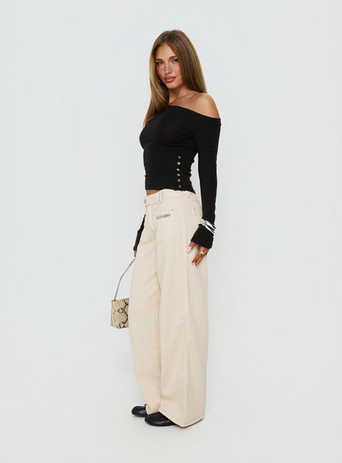 side view of model wearing Princess Polly Lifetimes Mid Rise Wide Leg Cargo Jeans Cream Mid Rise Jeans Jeans 