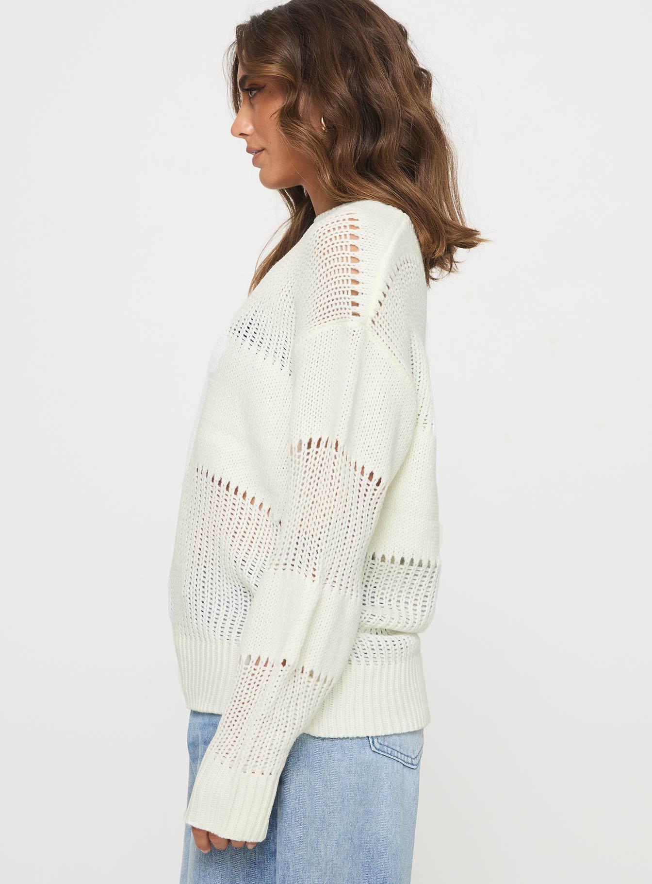 side view of model wearing Princess Polly Throw On Sweater Cream 