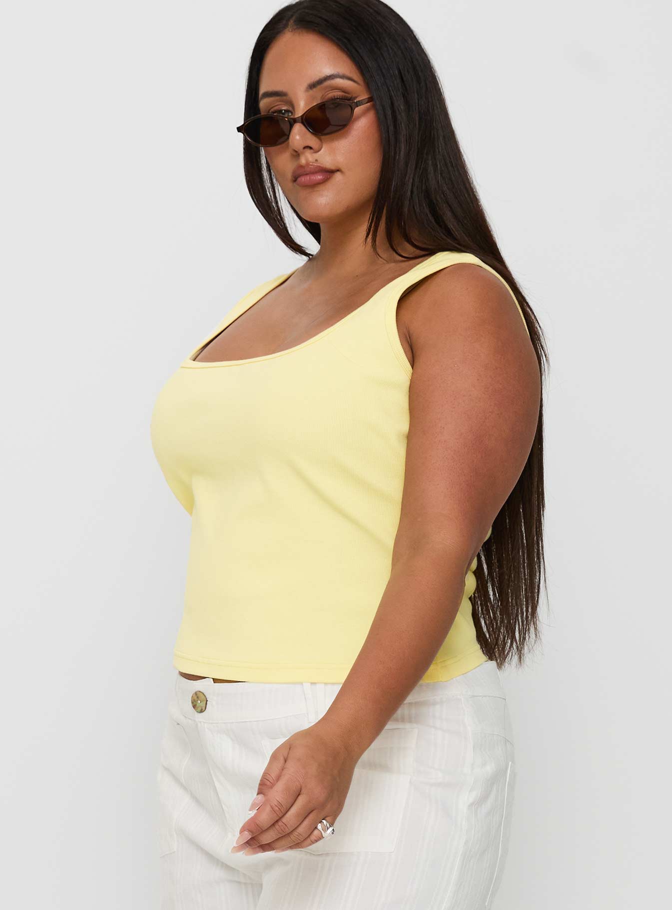 side view of model wearing Princess Polly Baseline Square Neck Rib Tank Top Lemon Curve Sleeveless Square Neck 