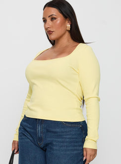 side view of model wearing Princess Polly Baseline Long Sleeve Top Yellow Curve Full Sleeves Scoop Neck 