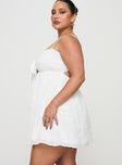 side view of model wearing Princess Polly Granno Mini Dress White Curve Plunger 