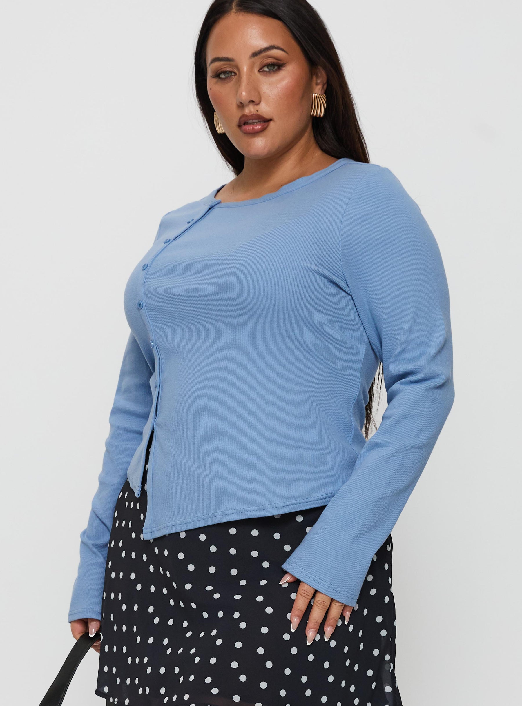side view of model wearing Princess Polly Baseline Button Up Long Sleeve Top Blue Curve Full Sleeves Crew Neck 