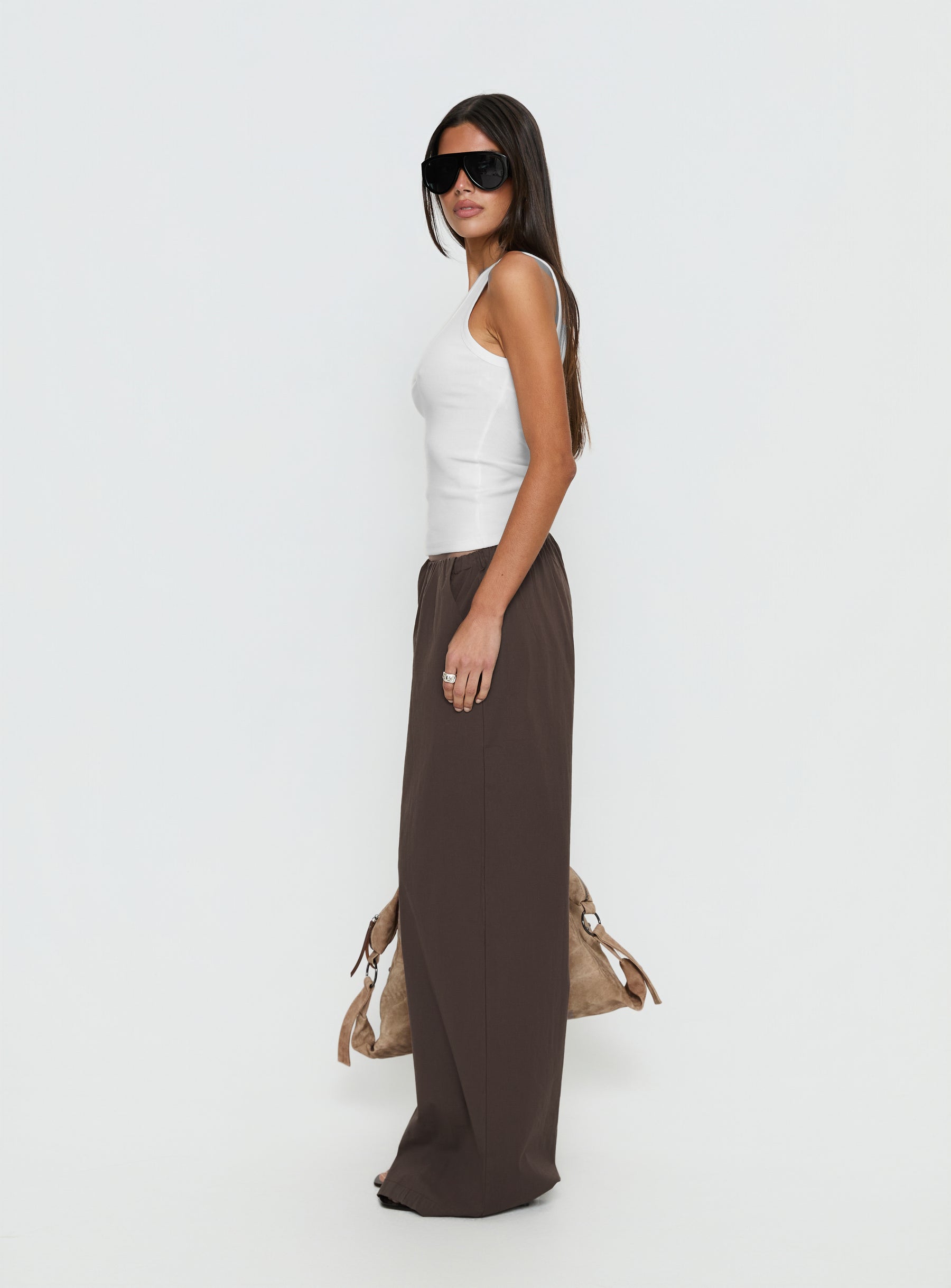 side view of model wearing Princess Polly Lunea Concealed Waistband Pants Brown Low Rise Pants 