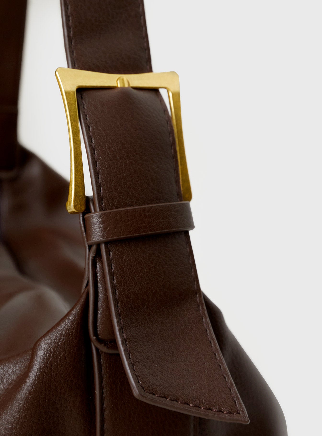 Brown Faux leather shoulder bag Adjustable shoulder strap, gold-toned hardware, zip fastening