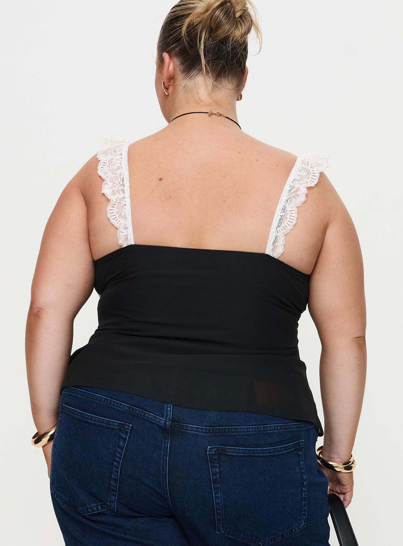 back view of model wearing Princess Polly Delvonte Top Black Curve Sleeveless Plunger 