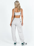 Matching set Crop top Fixed shoulder straps Scooped neckline Invisible zip fastening at side Track pants High rise Elasticated waistband Twin hip pockets Straight leg Extra cargo style leg pockets Elasticated cuff