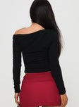 back view of model wearing Princess Polly Malian Long Sleeve Top Black Full Sleeves Asymmetric Neckline 