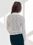 White long sleeve top Sheer lace material Classic collar Button fastening at front Good stretch