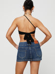 back view of model wearing Princess Polly Faya Low Rise Mini Denim Skirt Vintage Dark Wash Tall Mini Skirts 