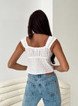Crop top Broderie anglaise  Fixed shoulder straps Tie fastening at front Split hem