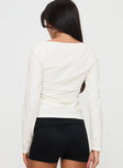 back view of model wearing Princess Polly Martini Bow Long Sleeve Top Cream Full Sleeves Boat Neck 