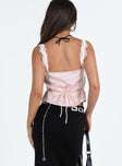 Cami top Silky material Lace trim Fixed shoulder straps V-neckline Waist tie fastening at back