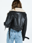 Cropped jacket Faux leather material Oversized collar Removable belts at waist and cuff Buckle fastening 