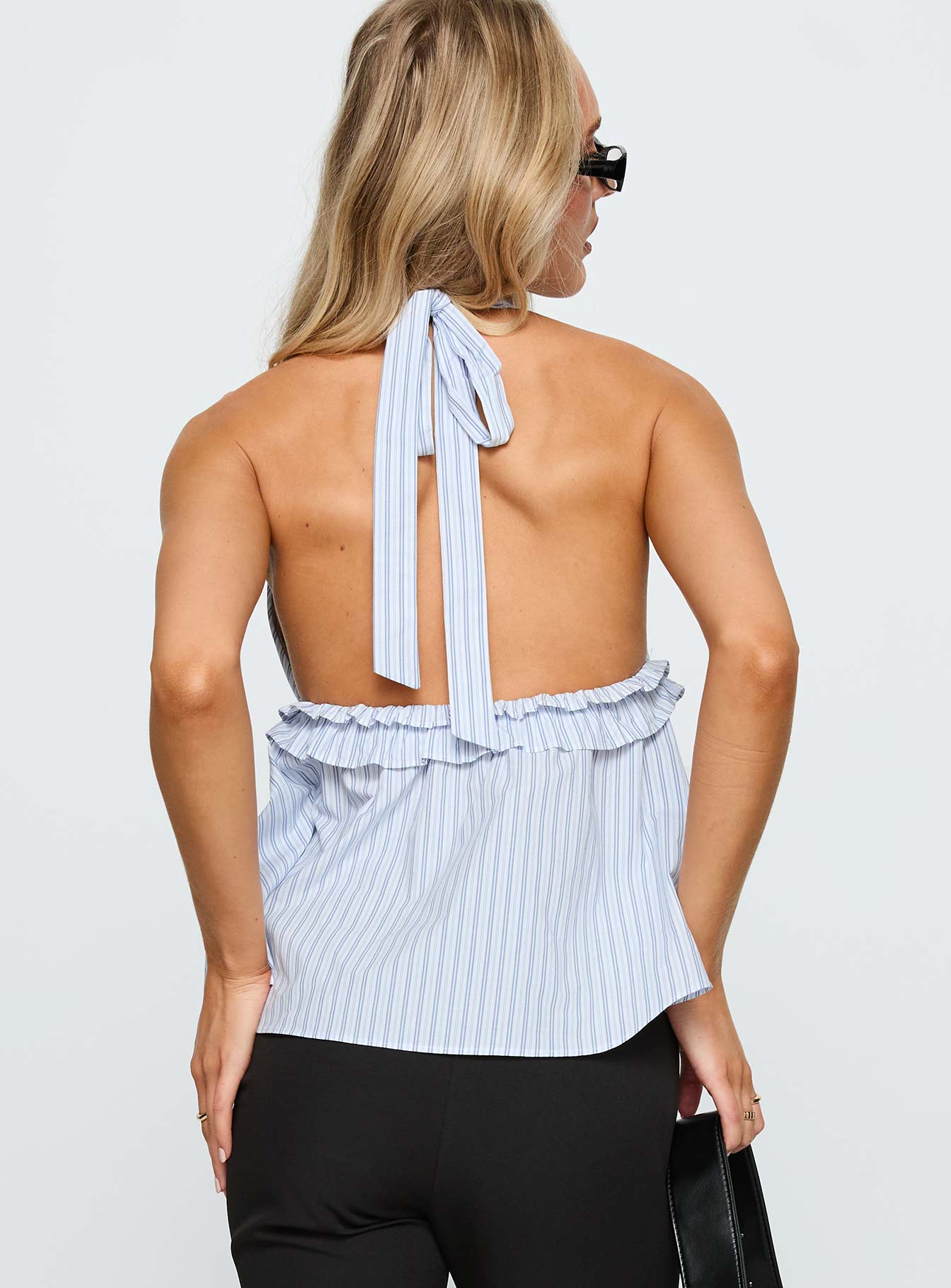 back view of model wearing Princess Polly Nautique Halter Ruched Top Blue Stripe Sleeveless Plunger 