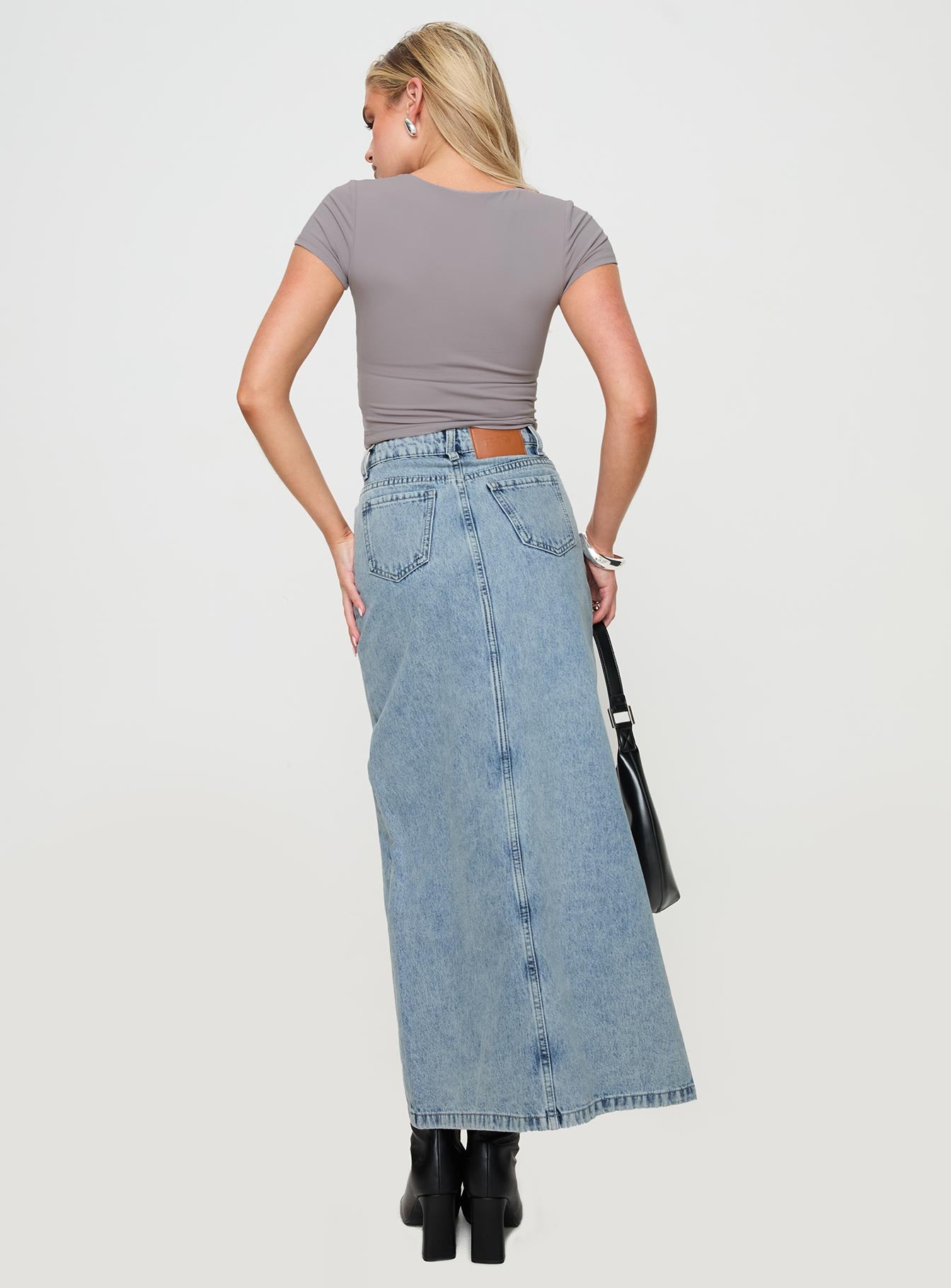 back view of model wearing Princess Polly Saige Denim Maxi Skirt Light Wash Maxi 