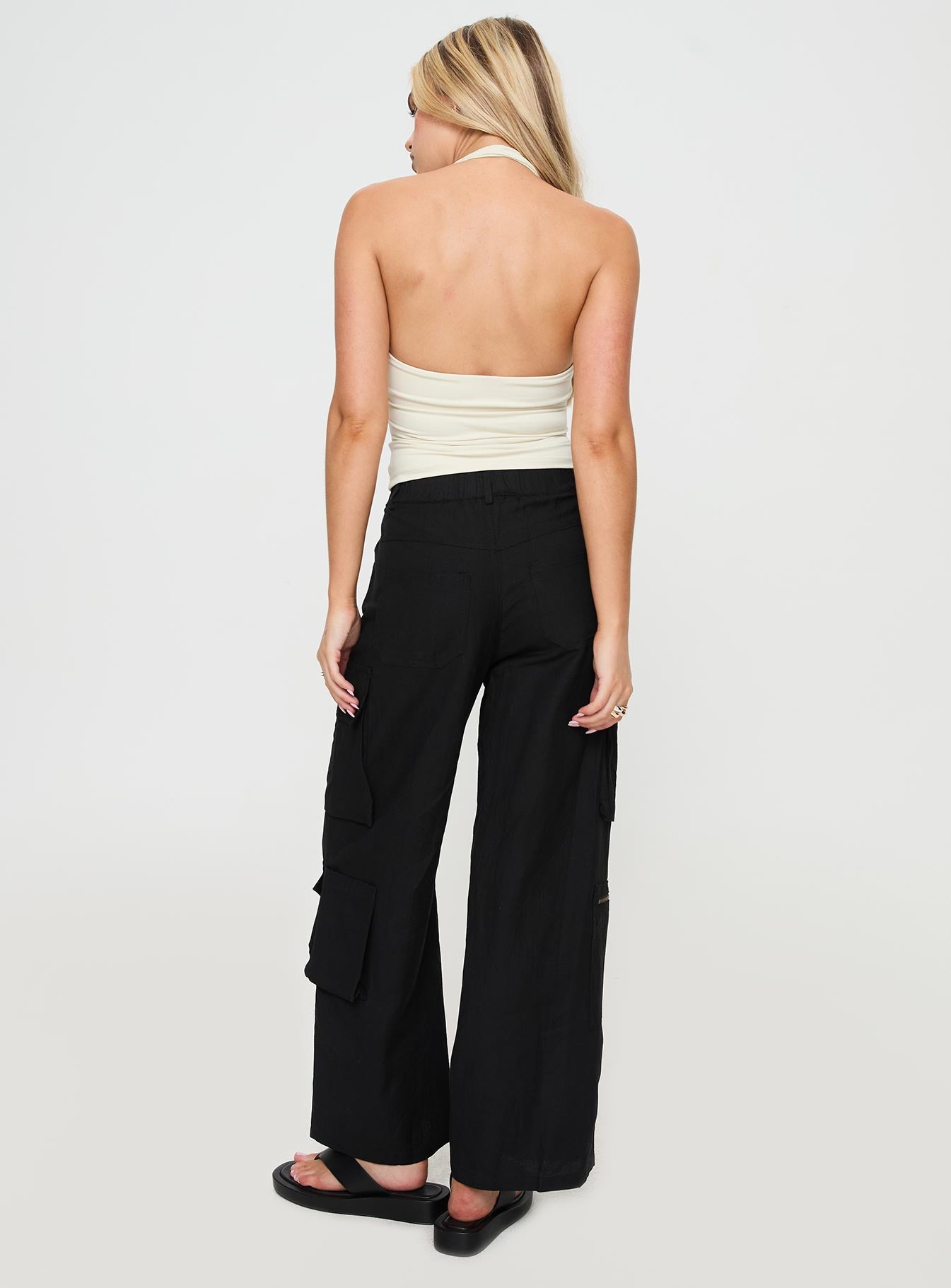 back view of model wearing Princess Polly Humphrey Cargo Pant Black Mid Rise 