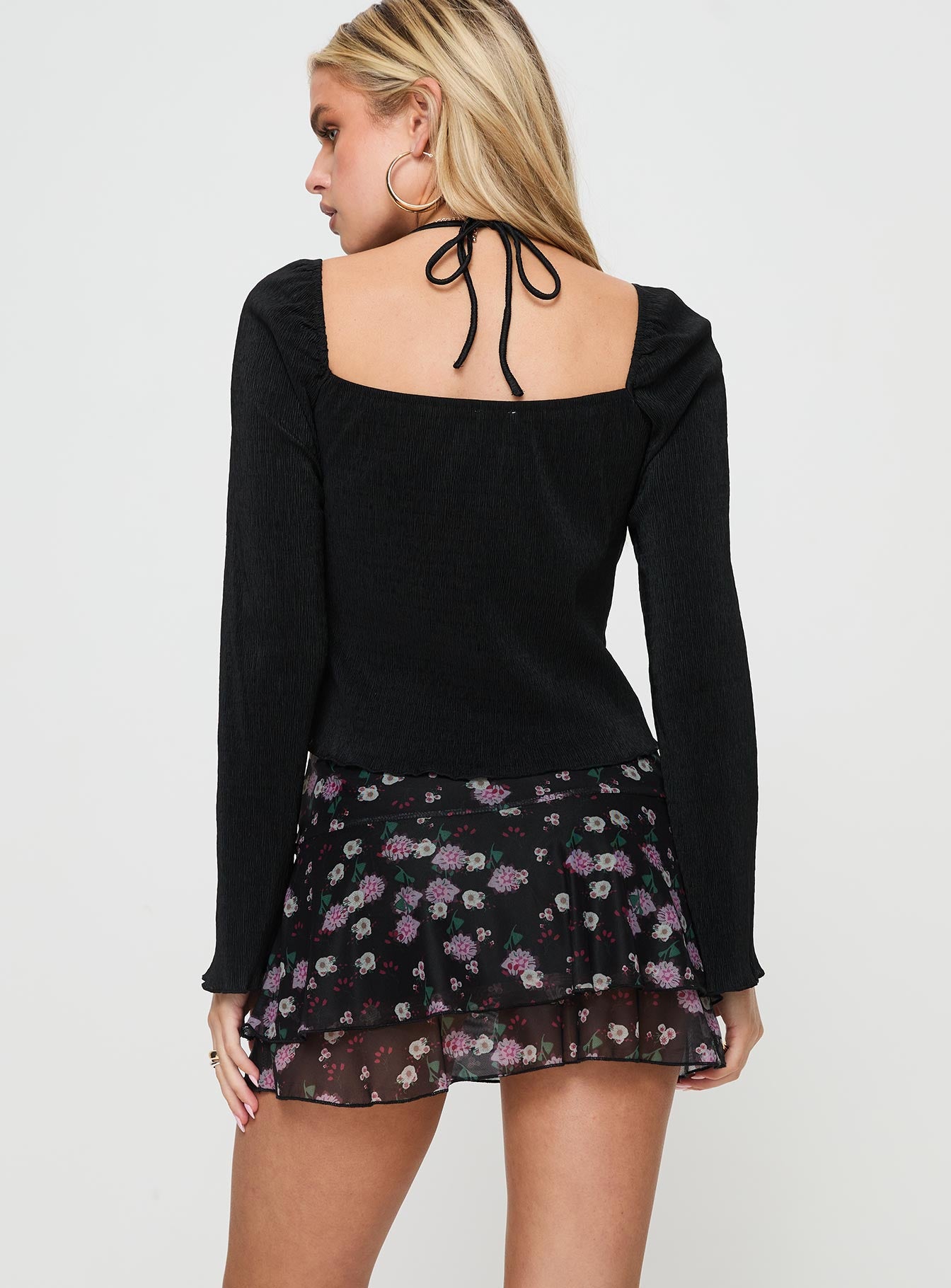 back view of model wearing Princess Polly Sunny Skies Mini Skirt Black Floral Mini Skirts 