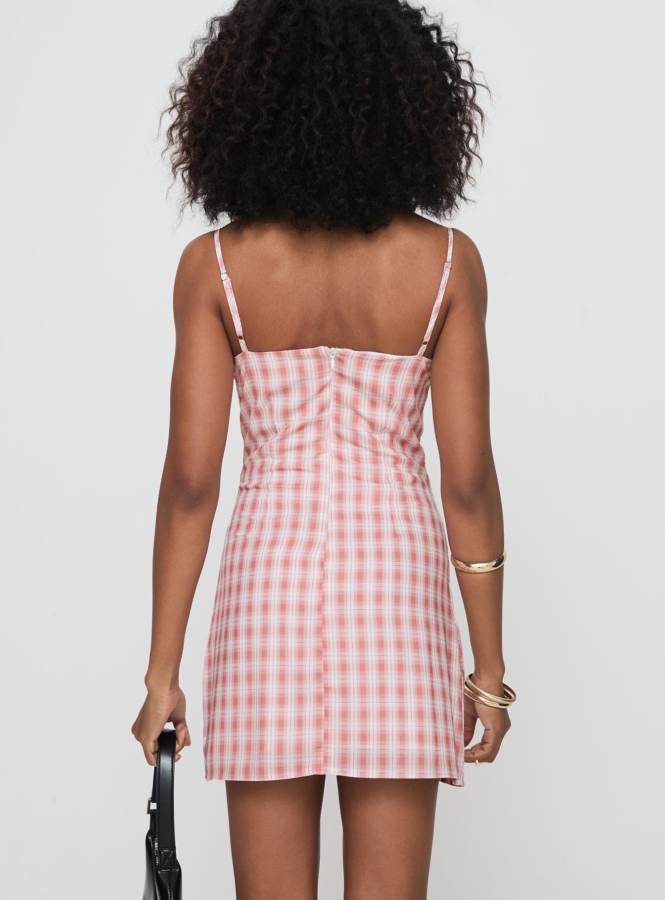 back view of model wearing Princess Polly Poto Mini Dress Pink Check Sweetheart Neckline 