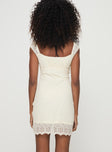 back view of model wearing Princess Polly Quillon Mini Dress Cream Sweetheart Neckline 