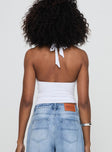 back view of model wearing Princess Polly Chilli Halter Top White Sleeveless Plunger 