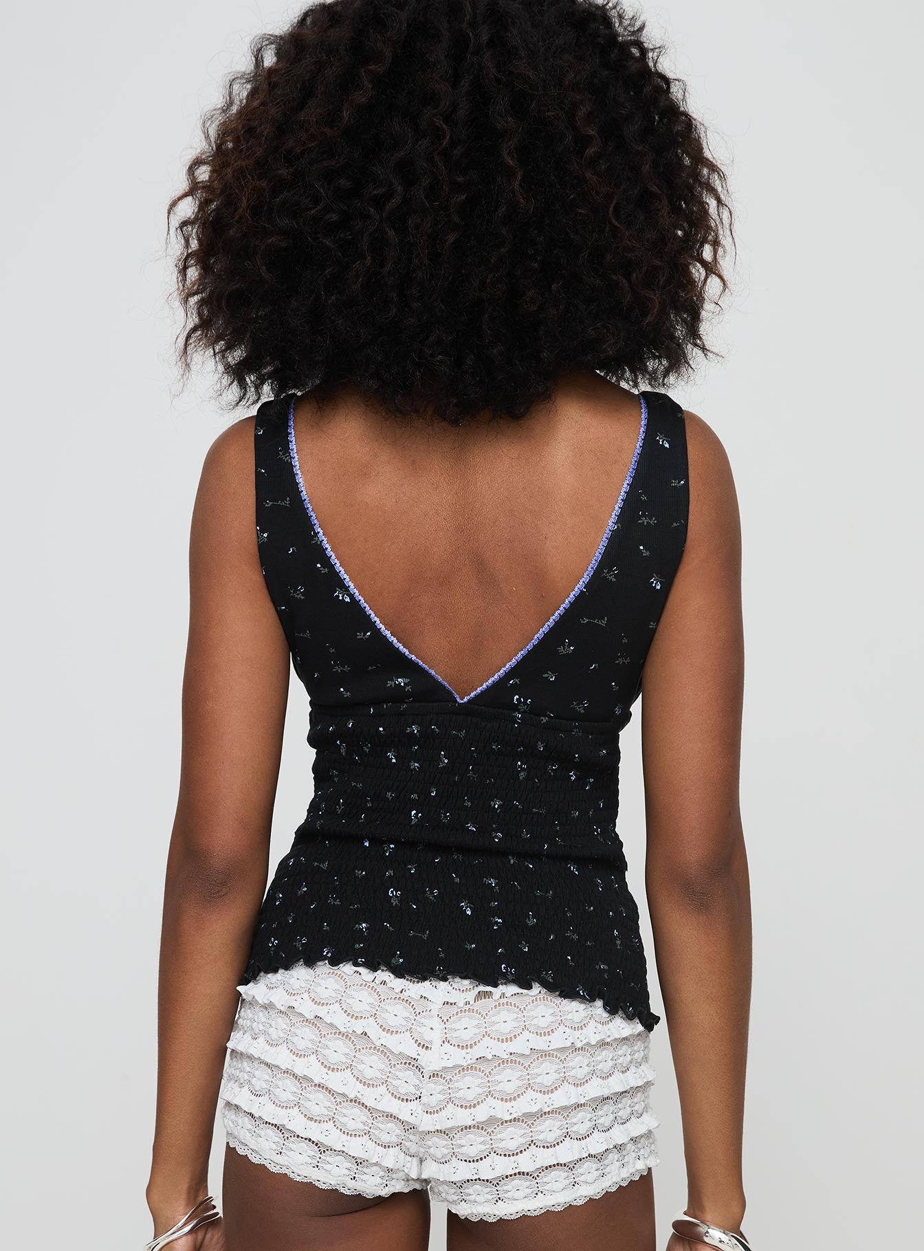 back view of model wearing Princess Polly Comfrey Top Black Sleeveless Plunger 