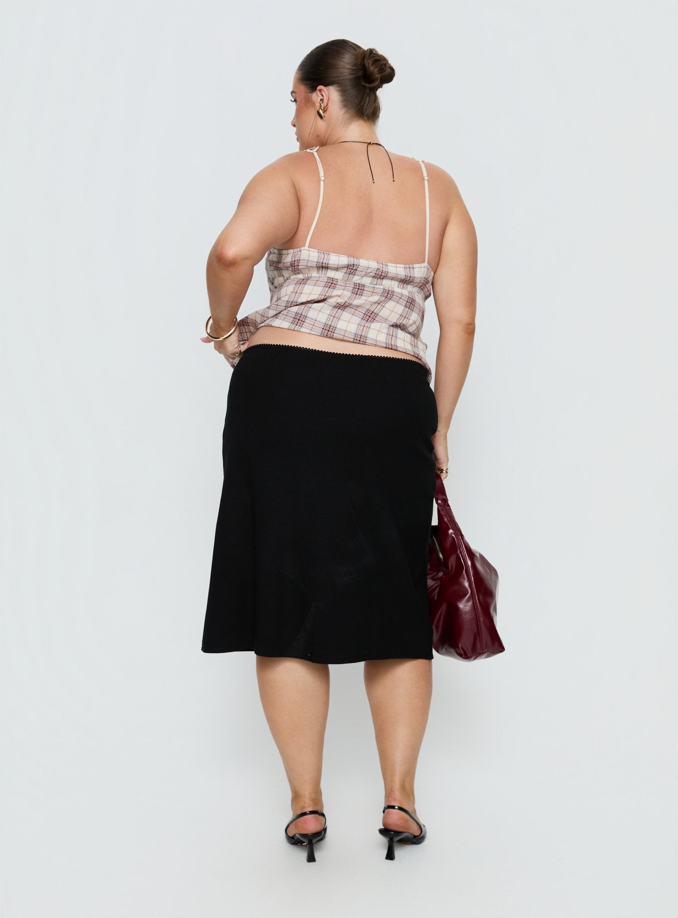 back view of model wearing Princess Polly Baseline Rib Midi Skirt Black Curve Midi Skirts 