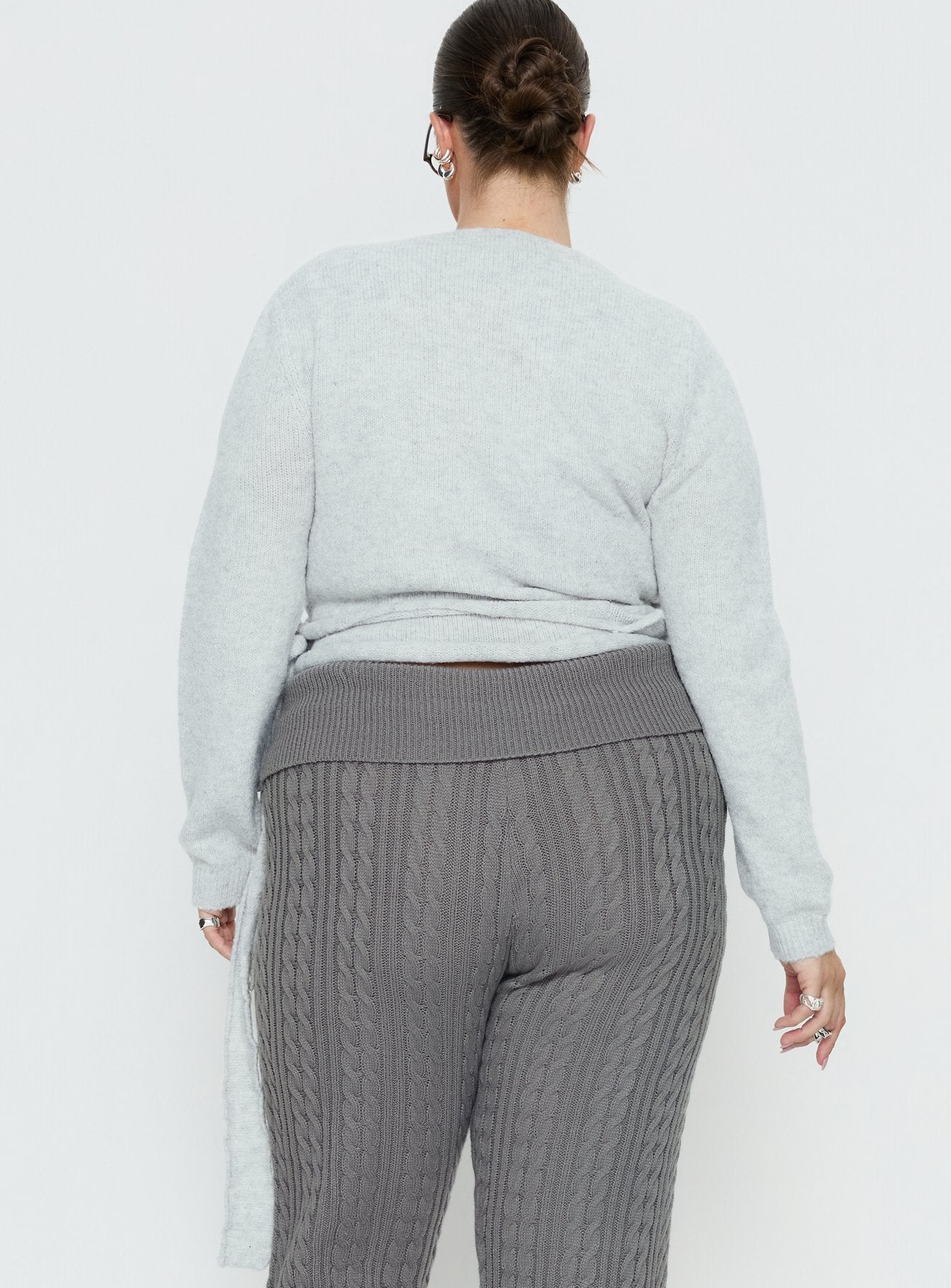 back view of model wearing Princess Polly Tonee Wrap Knit Cardigan Grey Curve cropped 