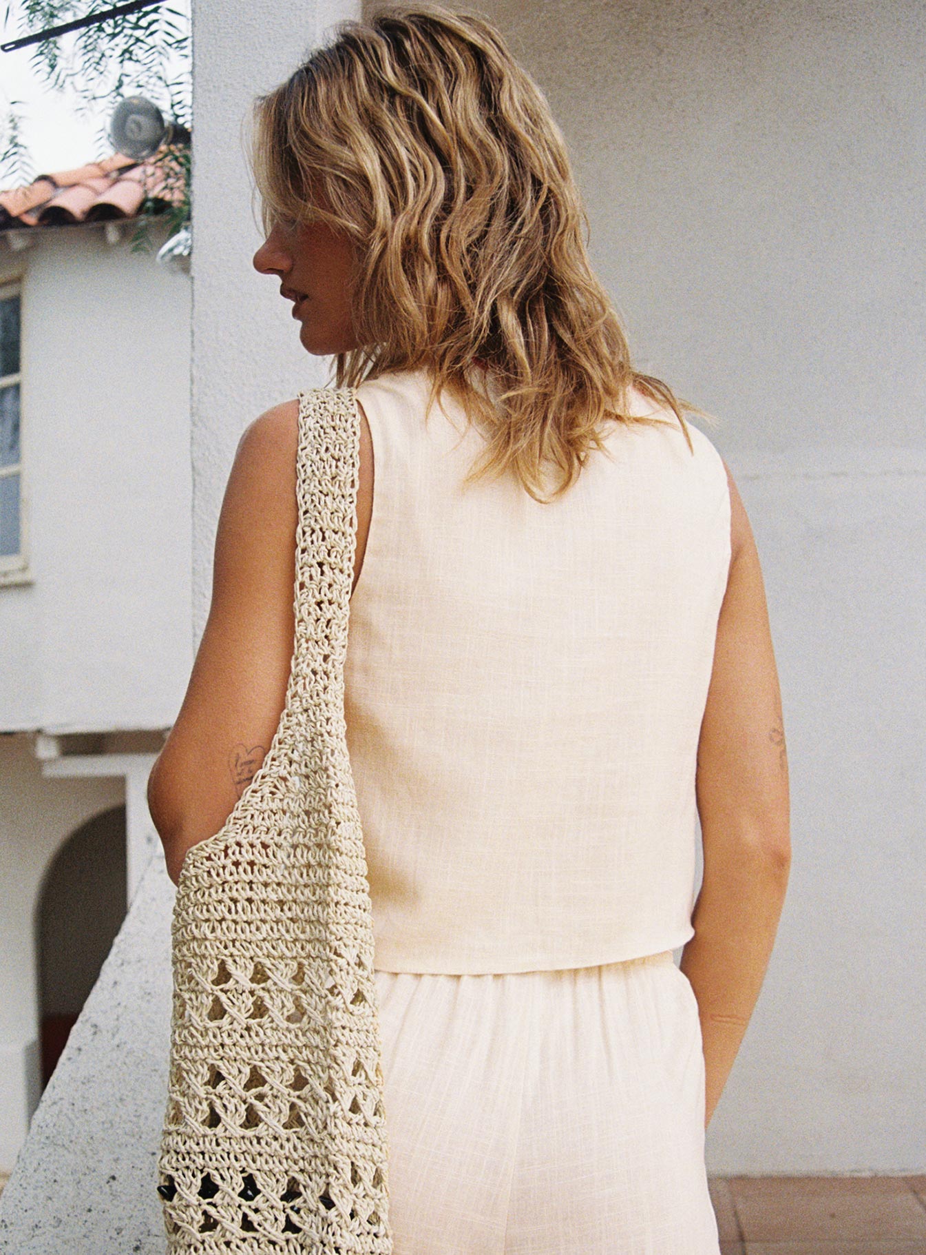 back view of model wearing Princess Polly Grazia Vest Top Cream / Red Sleeveless Plunger 