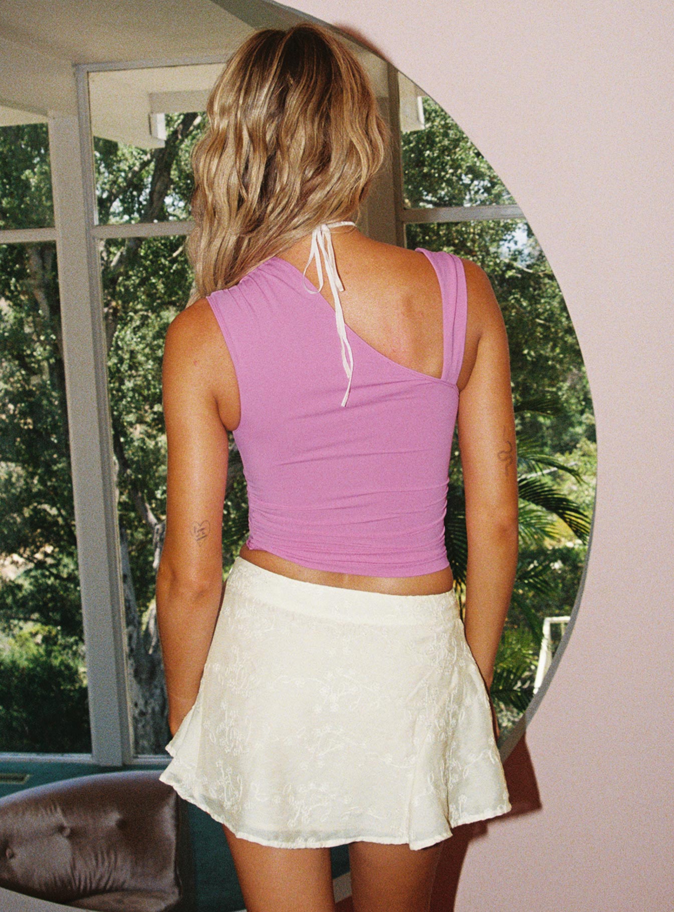 back view of model wearing Princess Polly Ander Top Pink Sleeveless Asymmetric Neckline 