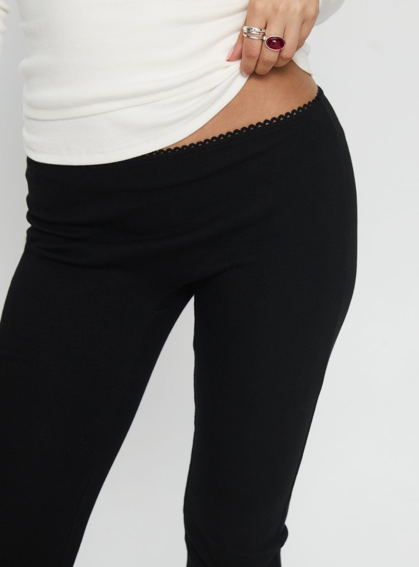 back view of model wearing Princess Polly Baseline Rib Capri Pants Black Tall Mid Rise Pants 