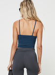 Cami Slim fitting, fixed straps, scooped neckline Good stretch, unlined