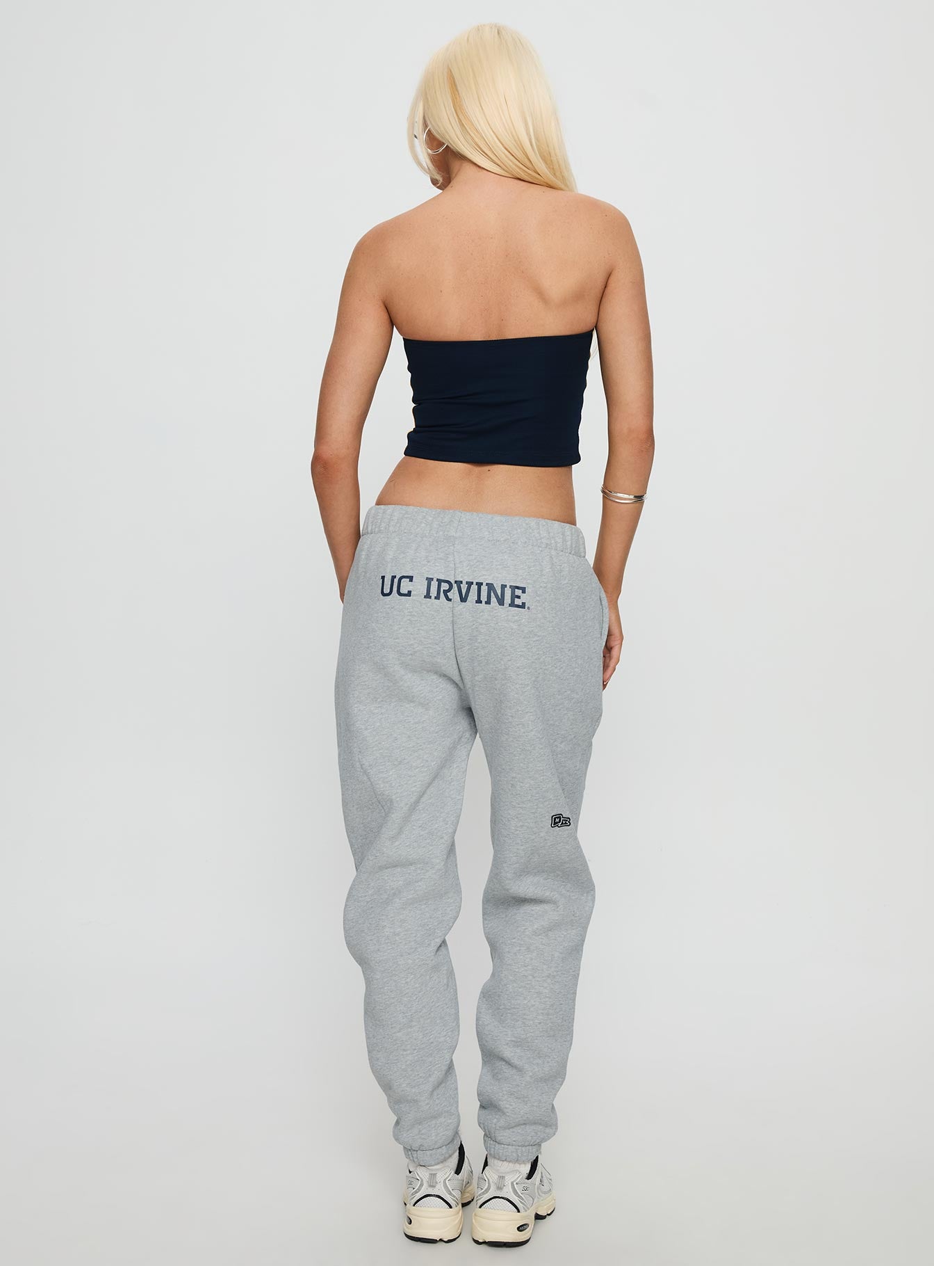 back view of model wearing Princess Polly UC Irvine Basic Sweatpants Grey Mid Rise Pants 