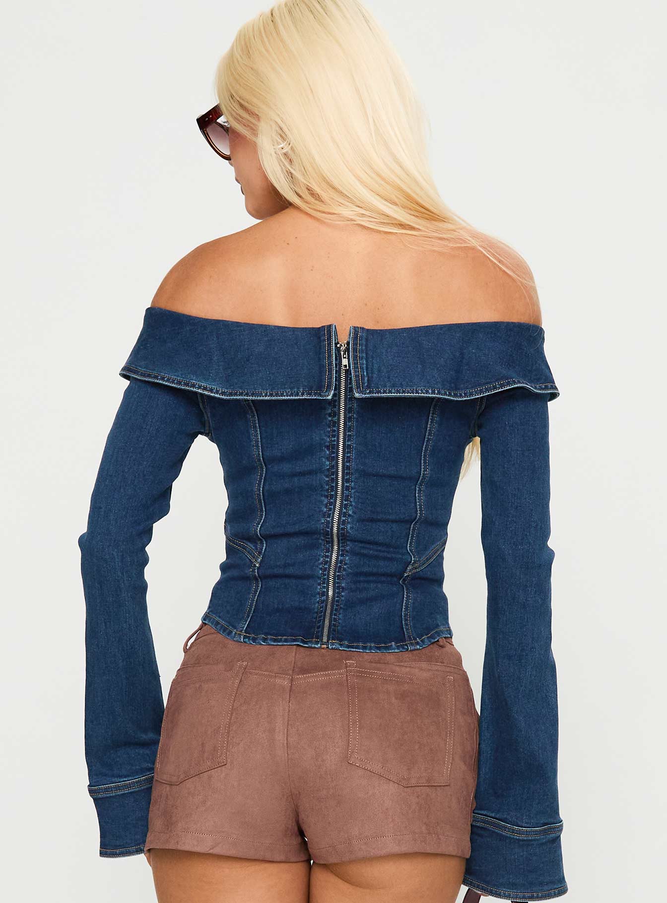 back view of model wearing Princess Polly In The Crowd Off Shoulder Top Dark Denim Full Sleeves straight 