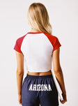 back view of model wearing Princess Polly U of A Homerun Tee Red / White Short Sleeves Crew Neck 