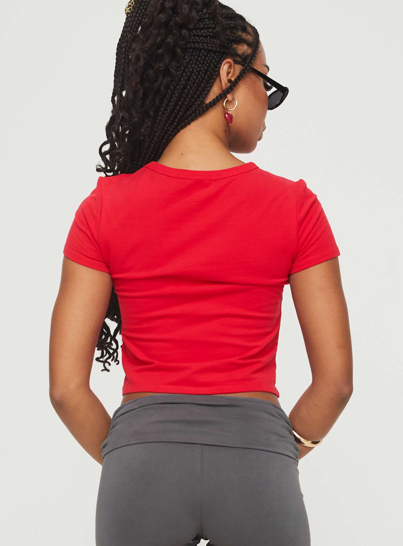 back view of model wearing Princess Polly Akeko Tee Red Short Sleeves Crew Neck 