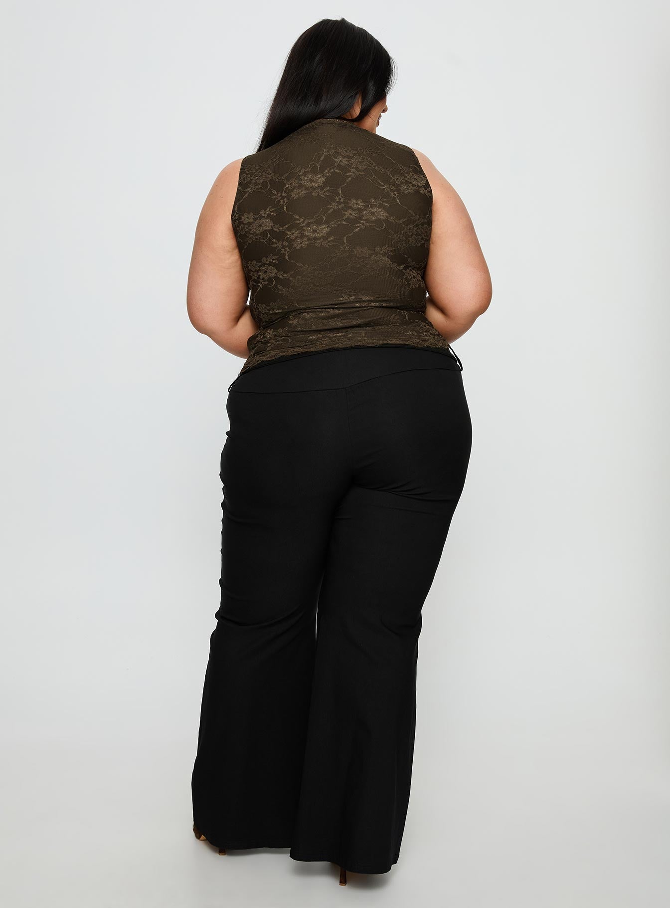 back view of model wearing Princess Polly Twinflame Low Rise Hardware Pants Black Curve Mid Rise Pants 