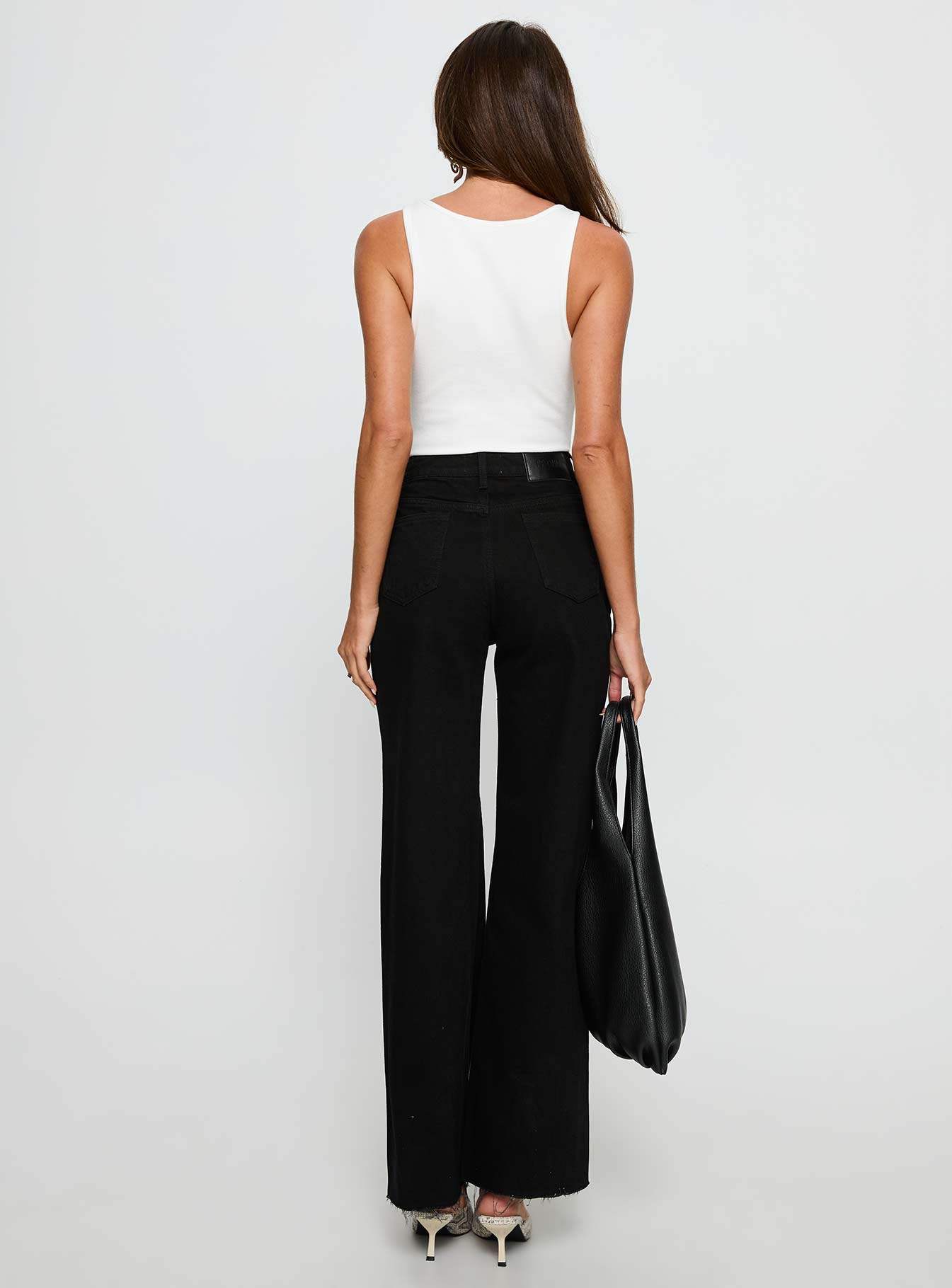 back view of model wearing Princess Polly Henesey High Rise Straight Leg Jeans Jet Black High Rise Jeans 