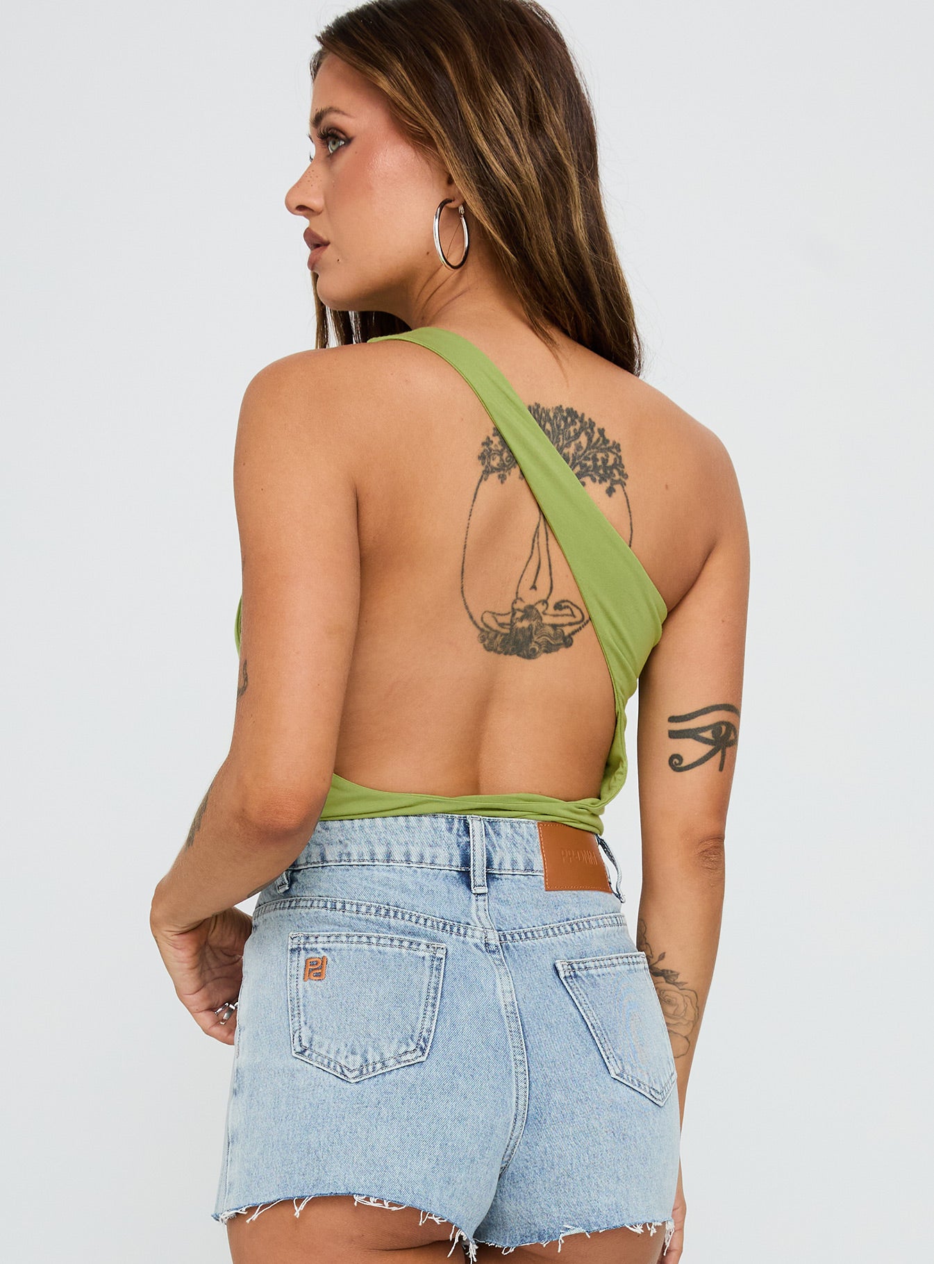 back view of model wearing Princess Polly Ferrera One Shoulder Bodysuit Green Sleeveless 